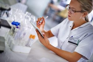 Healthcare researcher examining results in a lab