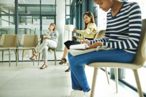 Female patients sit in doctor's waiting room